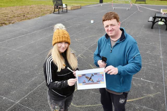 Artist Donna Forrester and and Adam Gillies of Friends of Inchyra Park show off the Spitfire mural design to be created in the middle of the park