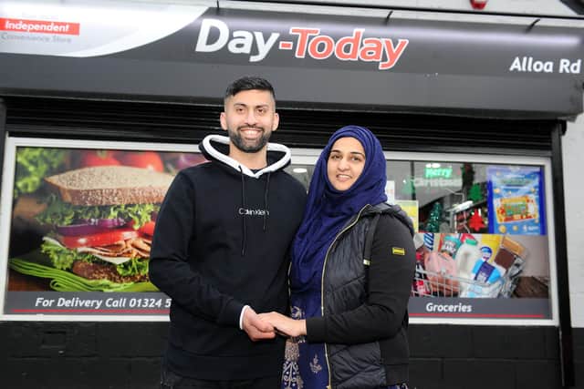 Jawad and Asiyah Javed, owners of Day-Today Express in Stenhousemuir, have collected two Local Retailer Awards. Picture: Michael Gillen.