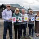 Walker Timber managing director Jim Gibson, with Bo’ness Car 4U publicity officer Val Ferguson, driver Ian Park, chairman Rod McNeill and Walker Timber’s office administrator Lorna Shanks. Pic: Michael Gillen