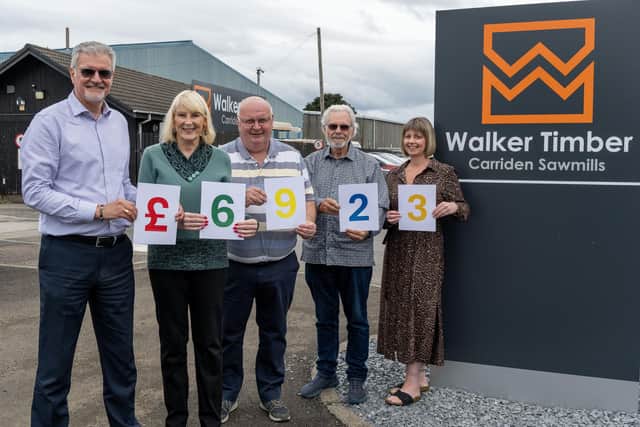Walker Timber managing director Jim Gibson, with Bo’ness Car 4U publicity officer Val Ferguson, driver Ian Park, chairman Rod McNeill and Walker Timber’s office administrator Lorna Shanks. Pic: Michael Gillen