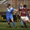 Stenhousemuir’s under-19s tussle for possession against Earlston Rhymers at Ochilview Park on Saturday in the Scottish Amateur Cup's first round (Pictures by Alan Murray)