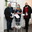 No.4 Salon and Training Academy in Denny is collecting essential toiletries in aid of the St Vincent De Paul (SVDP) Food Bank. Pictured: Michael Ryan, SVDP vice chairman; Marie Toner, salon owner; and Owen Williams SVDP member. Picture: Michael Gillen.