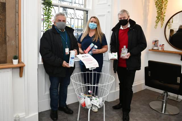 No.4 Salon and Training Academy in Denny is collecting essential toiletries in aid of the St Vincent De Paul (SVDP) Food Bank. Pictured: Michael Ryan, SVDP vice chairman; Marie Toner, salon owner; and Owen Williams SVDP member. Picture: Michael Gillen.