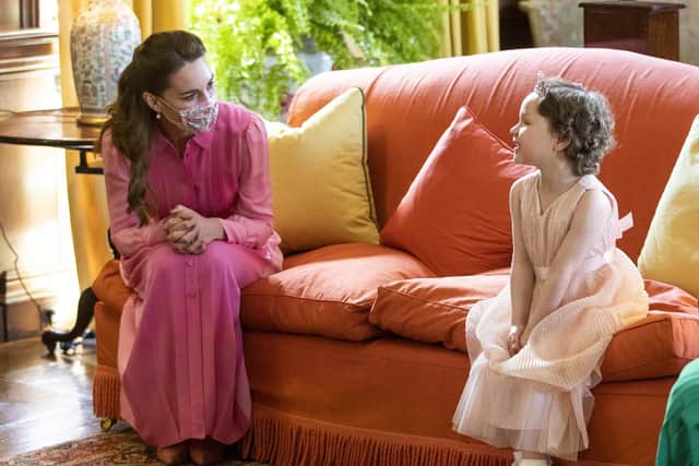 The Duchess of Cambridge meeting Mila Sneddon, then aged five, at the Palace of Holyroodhouse in Edinburgh in May last year