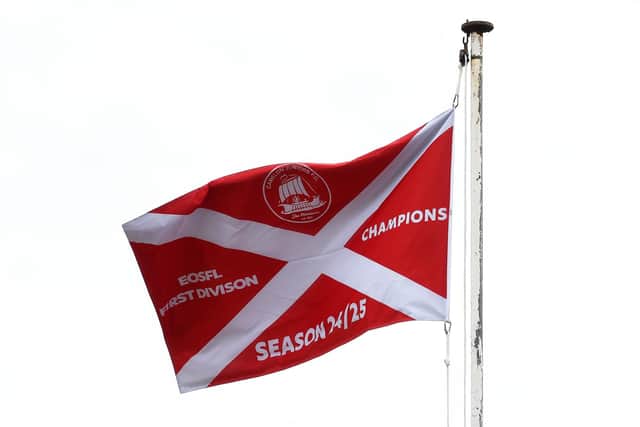 Flying the First Division winners' flag