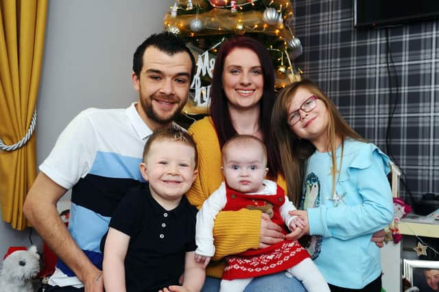 Nikki Aitken and Gary Graham with seven month old Lily, Ellie (7) and Owen (3).  Picture: Michael Gillen.