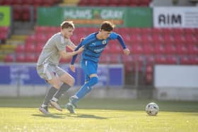 Bo’ness United ace Lucas Stenhouse looks to drive forward on the ball during the 3-1 Lowland League Cup final defeat to East Kilbride last Sunday (Photo: Michael Schofield/SLFL Media)