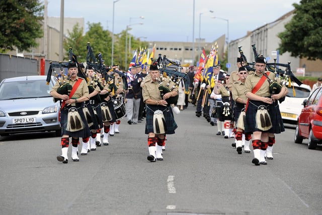 Balaklava Pipes and Drums lead the parade.