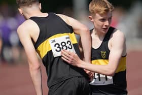 Under-17 ace Callum Hendry, who bagged silver at 800m, embraces Vics’ clubmate Luke Culliton, who sealed gold (Photo: Simon Wootton/Scottish Athletics)