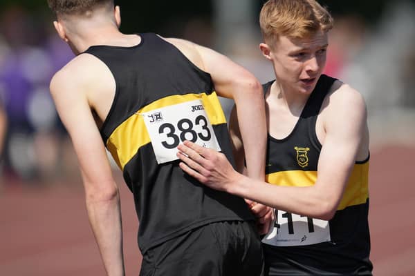 Under-17 ace Callum Hendry, who bagged silver at 800m, embraces Vics’ clubmate Luke Culliton, who sealed gold (Photo: Simon Wootton/Scottish Athletics)