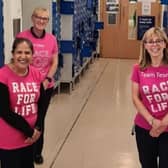 Falkirk Tesco's Race for Life team has raised funds for Cancer Research UK with their four-store walk