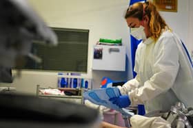 A nurse wearing an FFP3 face mask works on a patient in a critical care unit. Picture: PA Media