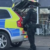 Armed police surrounded the shop at New Carron after reports of a man with a firearm. Pic: Tommy Smith.