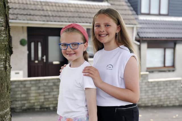 It's not just big sister and queen elect Ellie (right) who has a role in the Fair this year.  Little sister Kallie is a bower girl.  Pic: Michael Gillen.