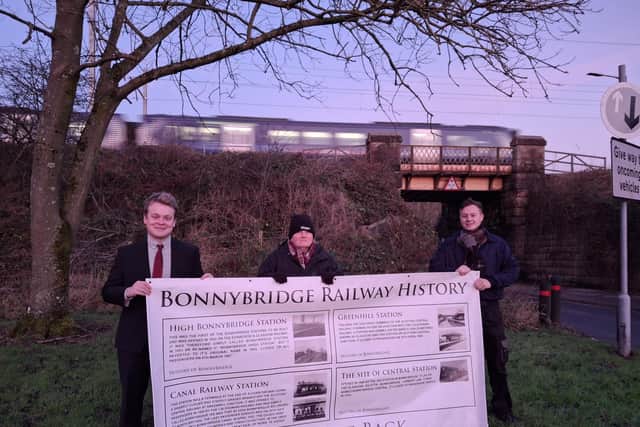 Falkirk MP Euan Stainbank, Baillie Billy Buchanan, Cllr Jack Redmond with a banner of the history of train stations in Bonnybridge