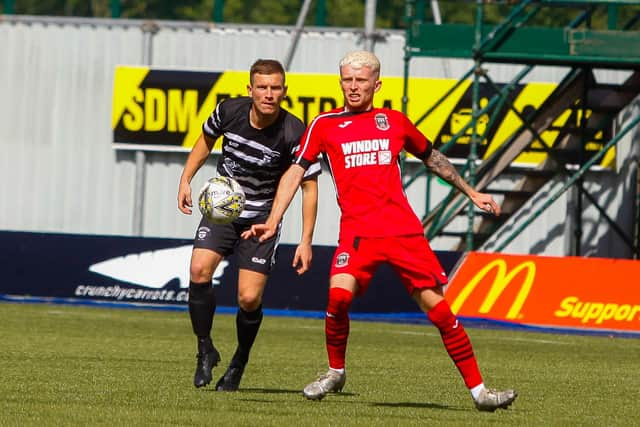 Shire summer signing Gregor Fotheringham looks to win the ball