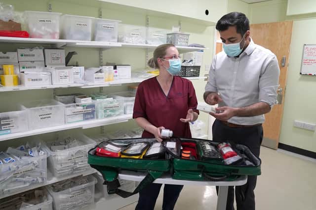 Health Secretary Humza Yousaf with lead advanced nurse practitioner Louise Kirby as she packs a treatment bag ahead of a home visit. Pic: Andrew Milligan/PA Wire