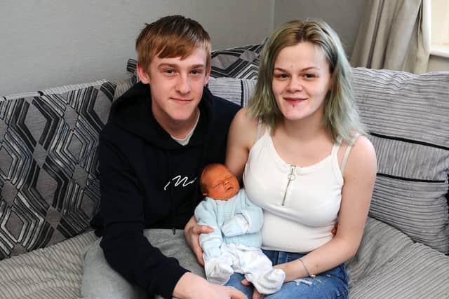 Liam McMinn and Natasha Quigley with their baby boy Hunter McMinn who was born at 11.55am on New Year's Day weighing 6lb 1oz.