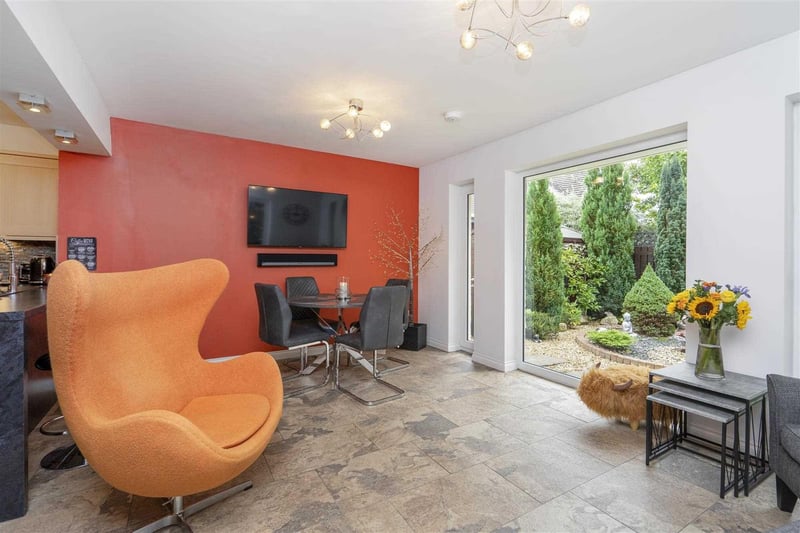 The open plan kitchen/family room has doors that open out into the garden.