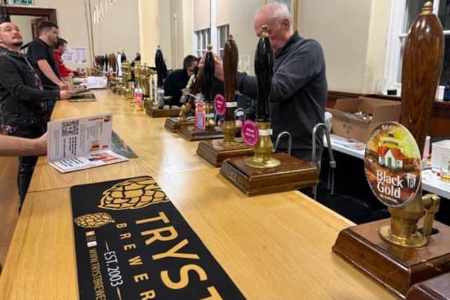 A volunteer pours one of thirty beer taps offered to visitors at the festival’s 25th edition. (Pic: Finlay Godfrey)