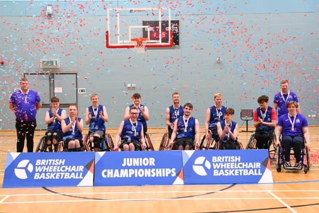 Roman Murray, pictured in the pink t-shirt, helped earn Scotland a gold victory over the weekend (Photo: British Wheelchair Basketball/AhmedPhotos)