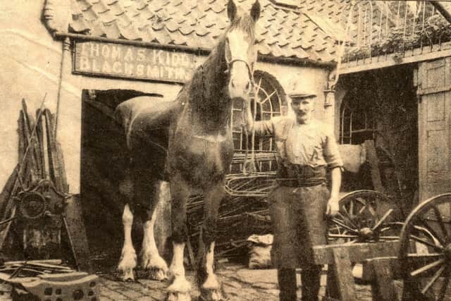 Carnera with blacksmith William Gribbin.