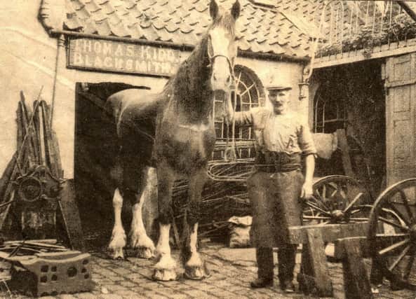 Carnera with blacksmith William Gribbin.
