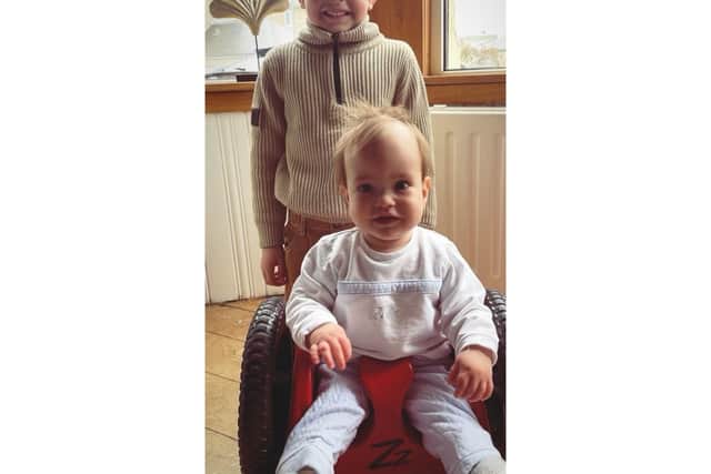 Theo Hardie with his little brother Jude who was born with spina bifida and hydrocephalus.