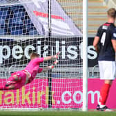 Simon Murray's free-kick eludes the diving Robbie Mutch to send Falkirk to their first league defeat of the season (pic: Michael Gillen)