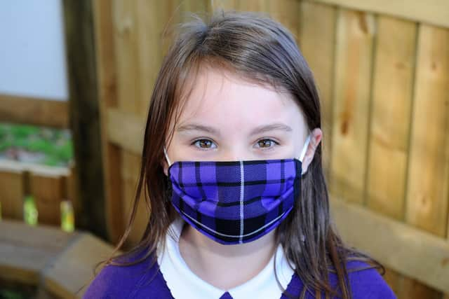 Langlees Primary School P6 pupils selling and promoting reusable face masks (Pic: Michael Gillen)