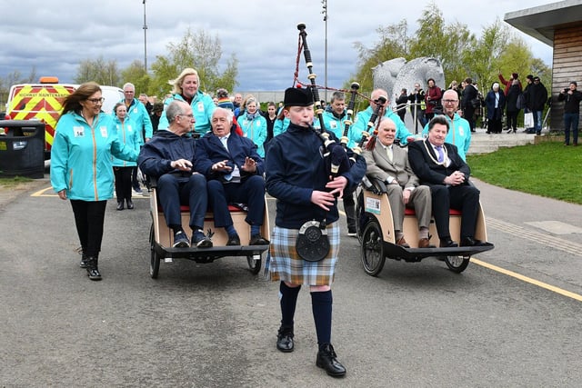 Special guests at the opening were given a ride in the trishaws, ridden by local volunteers, and led by 12-year-old piper Harris Cooper.