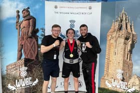 Stephanie Kernachan with her William Wallace Box Cup gold medal pictured alongside Falkirk Phoenix Boxing Club coaches Alan Hill, left and Jamie Hill, right (Photo: Submitted)