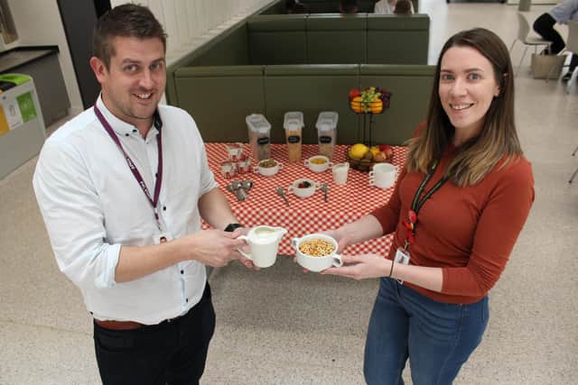 Gareth Davies, chef manager for Forth Valley College and Lynne Tomlinson, communications and marketing coordinator for Forth Valley Student Association preview the free breakfast table