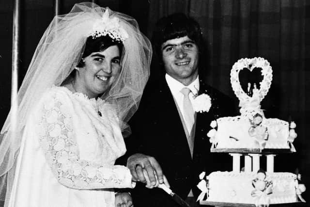 Sandra and Peter Bryans cutting the cake on their wedding day on September 12, 1970