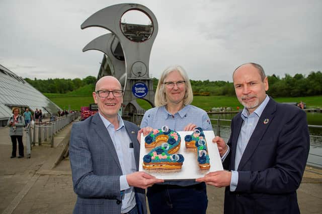 Transport Minister Kevin Stewart; Maureen Campbell, Scottish Canals chair and Richard Millar, Scottish Canals interim CEO, mark the 21st birthday of The Falkirk Wheel.  Pic: Peter Sandground.