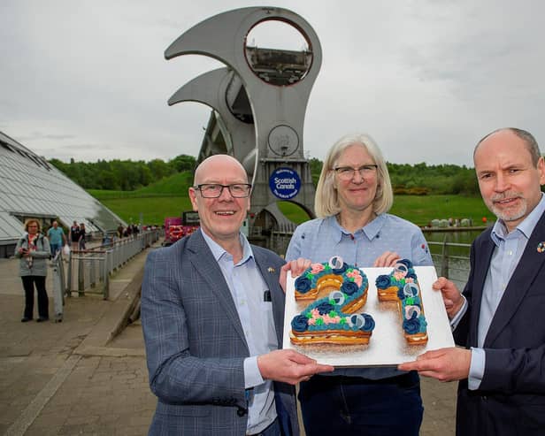 Transport Minister Kevin Stewart; Maureen Campbell, Scottish Canals chair and Richard Millar, Scottish Canals interim CEO, mark the 21st birthday of The Falkirk Wheel.  Pic: Peter Sandground.