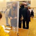 Residents cast their votes at Bowhouse Community Centre polling station which has had to set up additional safety measures due to the COVID-19 pandemic