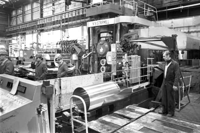Men working in the British Alcan aluminium coil and sheet factory in Falkirk, March 1985. Picture shows the No 8 stripmill.