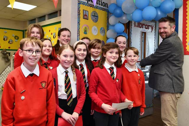 Library Leaders made up of pupils from primary 6 and 7 with author Alastair Chisholm at the official opening of the new library.  (Pictures: Michael Gillen)