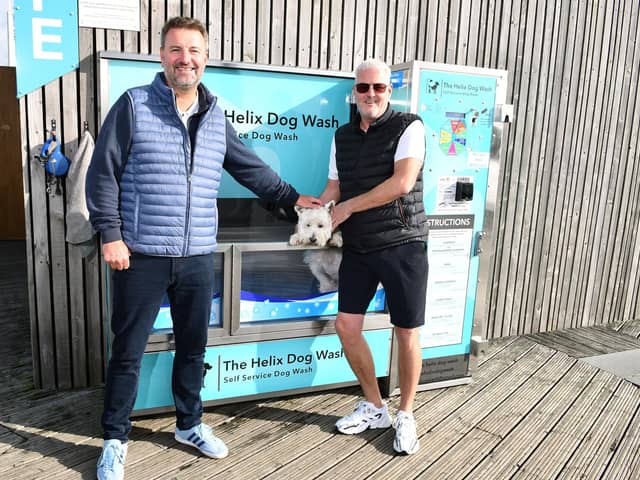 Helix Dog Wash directors, Kevin Carr and Colin Inglis with Oscar who has just tried out the news facility. Pic: Michael Gillen