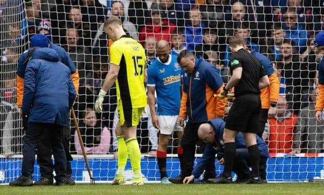 The start of the second half at Ibrox was delayed as broken glass is removed from Celtic 'keeper Joe Hart's goal. (Photo by Craig Williamson / SNS Group)
