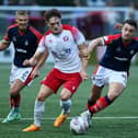 Falkirk captain Stephen McGinn in action during the Viaplay Cup group stages (Photo: Michael Gillen)