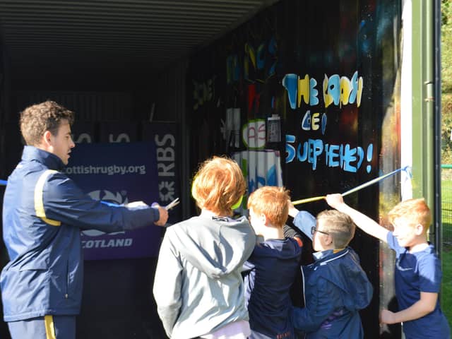 Chris Laidlaw with youngsters at Bo'ness Rugby Club Crash Den opening