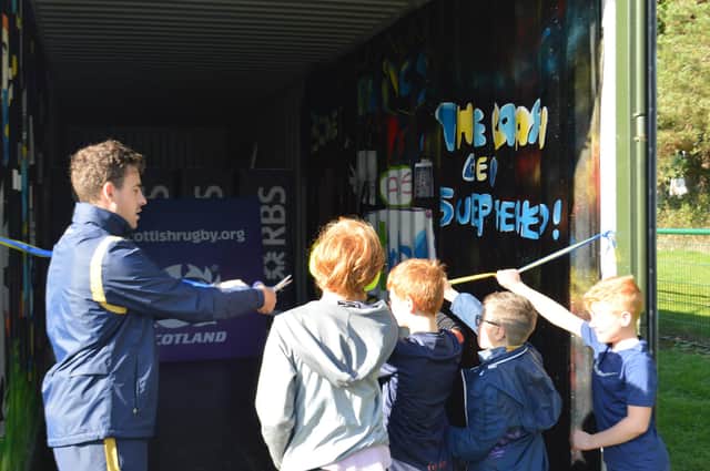 Chris Laidlaw with youngsters at Bo'ness Rugby Club Crash Den opening