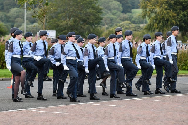 The teenagers from the air cadets come to attention.