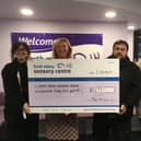 Cash raised for Forth Valley Sensory Centre from Christmas light display in Falkirk garden, left to right, Sara Burns, FVSC’s energy adviser, Jacquie Winning, chief executive of FVSC, Gordon Miller and Pamela Miller