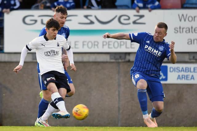 Falkirk's Charlie Telfer with Peterhead duo Rory McAllister  and Scott Brown. Picture Michael Gillen.