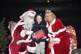 There was lots of fun when the annual Christmas light switch on organised by BuzzNess took place on Saturday. And here's young Ezra Conway McBride, six, meeting Santa and Mrs Claus.