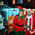 Pamela and Gordon Miller outside their home in Kersehill Circle and the Christmas lights display that is helping raise funds for Forth Valley Sensory Centre.