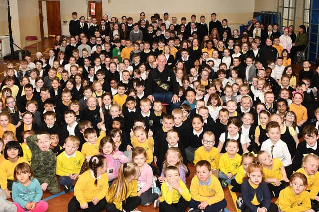 Pupils gather to maker the retirement of janitor Iain Aitchison after 21 years at Carronshore Primary School
